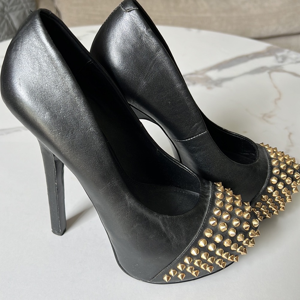 Gold spike stilettos
